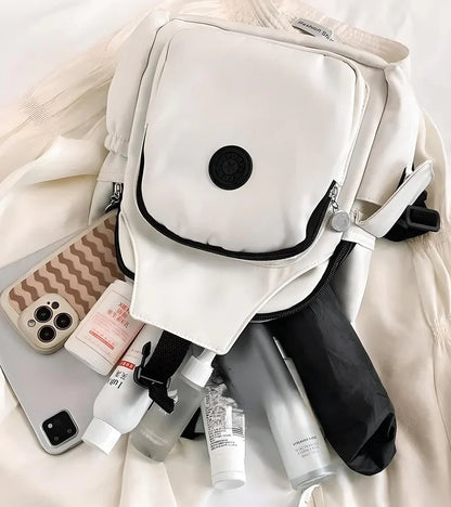 Poikittain kannettava olkalaukku